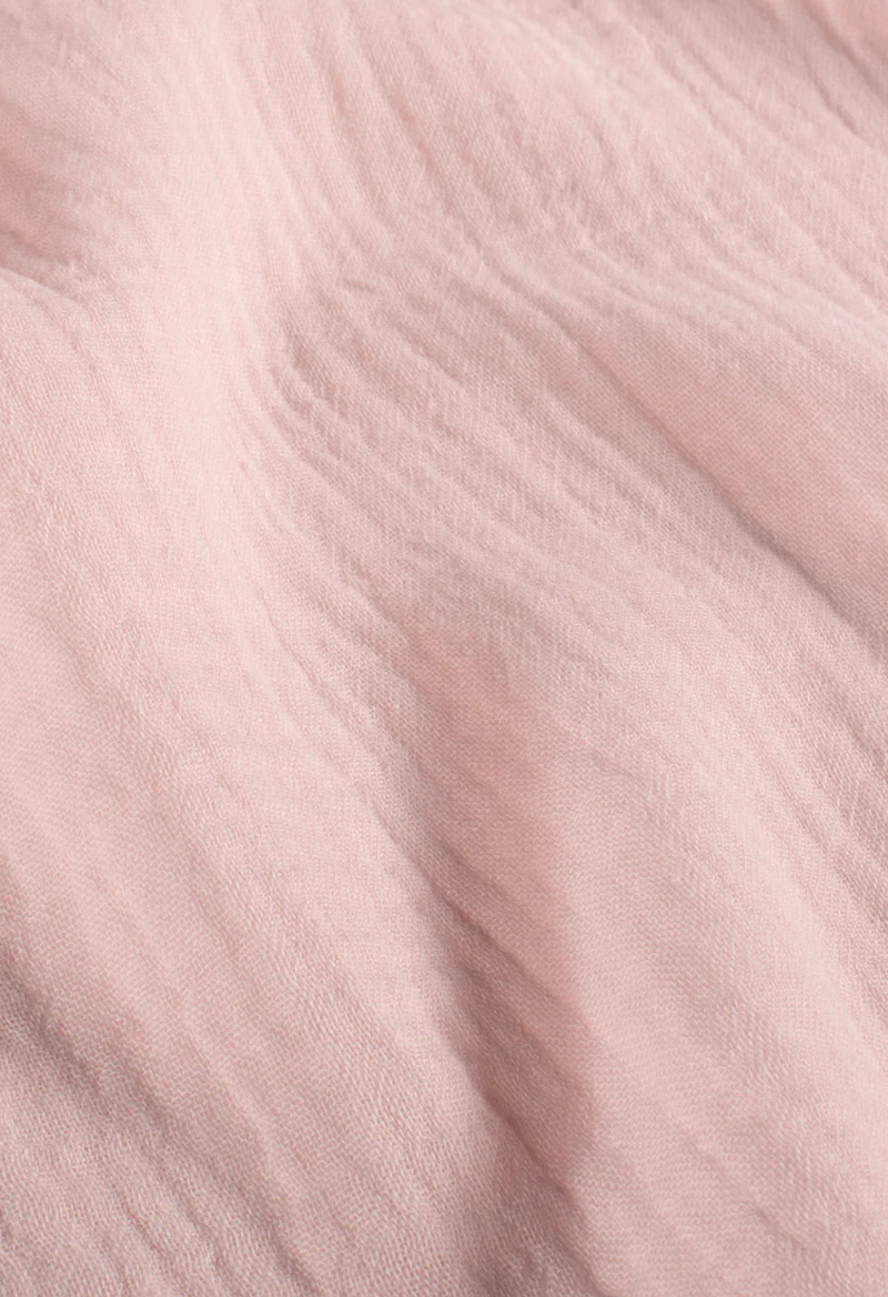 Tissu gaze de coton rose pâle